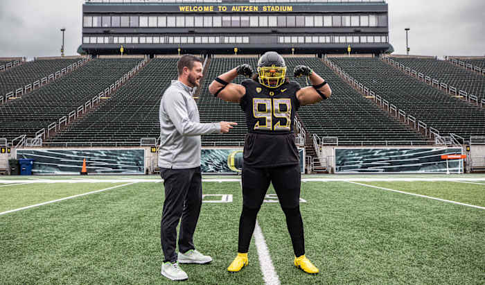 Jericho Johnson and Dan Lanning inside Autzen Stadium.